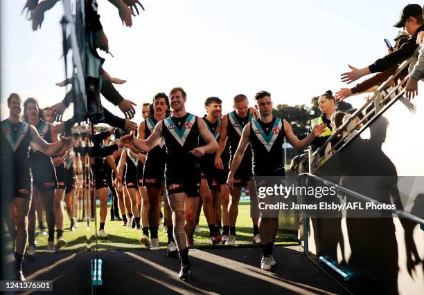 Tom Jonas and Karl Amon of the Power celebrate their win during the 2022 AFL Round 14 match between the Port Adelaide Power and the Sydney Swans at...