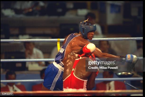 FELIX SAVON OF CUBA CONNECTS WITH A POWERFUL RIGHT HAND TO THE HEAD OF DAVID IZONRITEI OF NIGERIA DURING THE FINAL OF THE HEAVYWEIGHT BOXING...
