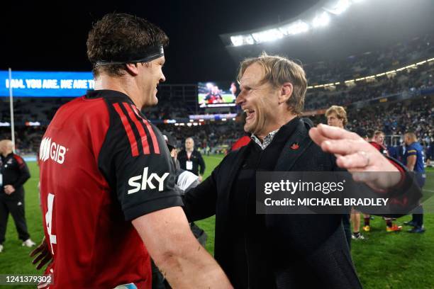 Scott Barrett and Scott Robertson coach of the Crusaders celebrate after their victory in the Super Rugby Pacific final match between the New...