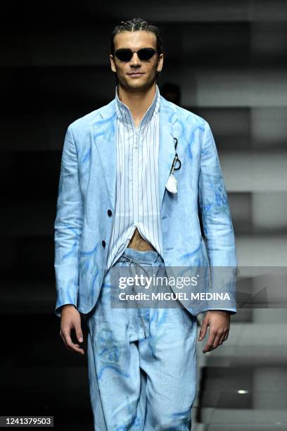 Model presents a creation for Emporio Armani's Men's Spring-Summer 2023 fashion collection on June 18, 2022 in Milan.