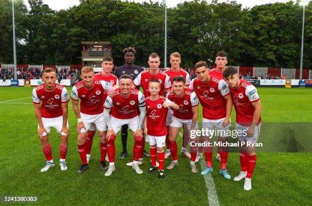 Dublin , Ireland - 17 June 2022; St Patrick's Athletic team pose for a picture with match day mascot Mason Cox during the SSE Airtricity League...