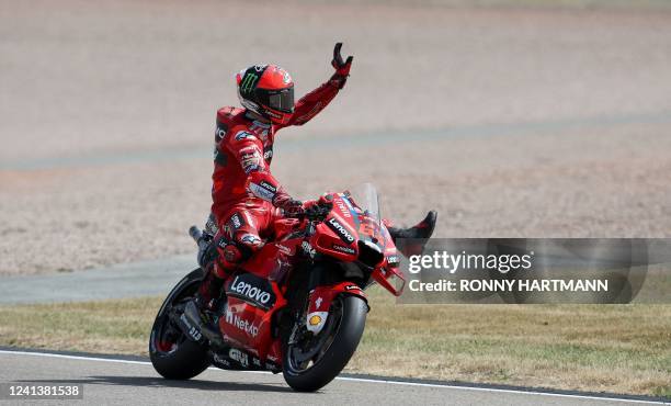 Ducati Lenovo Team Italian rider Francesco Bagnaia waves after winning the qualifying session of the MotoGP German motorcycle Grand Prix at the...