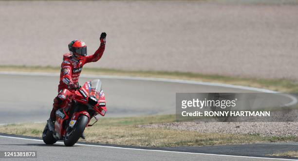 Ducati Lenovo Team Italian rider Francesco Bagnaia waves after winning the qualifying session of the MotoGP German motorcycle Grand Prix at the...