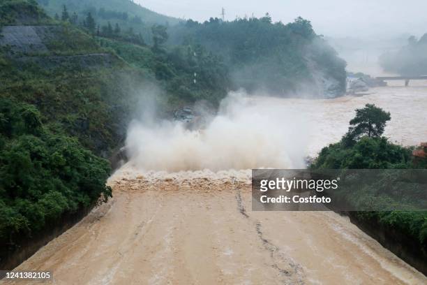 Floodwater is released from siweihe Reservoir in Changan Town, Rongan County, Liuzhou City, South China's Guangxi Zhuang Autonomous Region, June 18,...