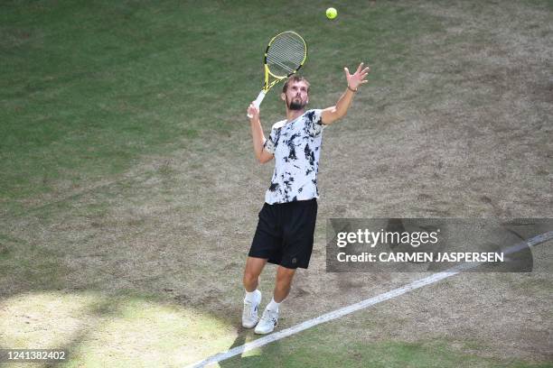 Germany's Oscar Otte serves the ball to Russia's Daniil Medvedev during their men's singles semi-final tennis match at the ATP 500 Halle Open tennis...