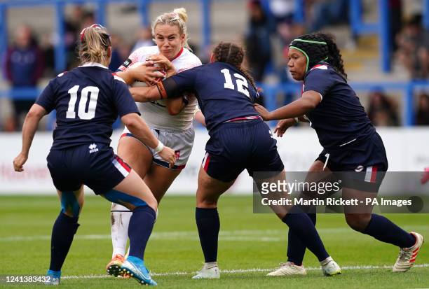 EnglandÕs Grace Field is tackled by FranceÕs Gaelle Alvernhe and Perrine Monsarrat and Elodie Pacull during the Women's International match at the...