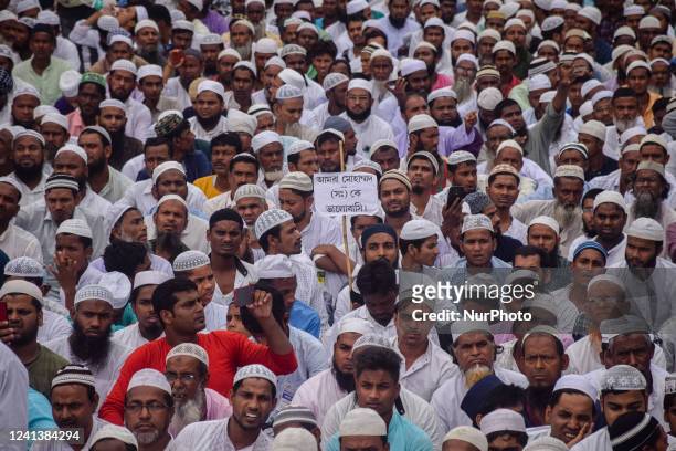 Muslim men participate in an anti-government demonstration to demand the arrest of Bharatiya Janata Party member, Nupur Sharma on account of her...