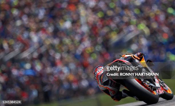 Repsol Honda German rider Stefan Bradl steers his motorbike during the qualifying session of the MotoGP German motorcycle Grand Prix at the...