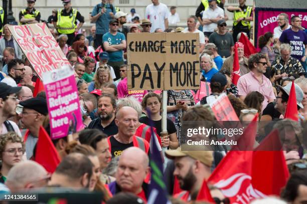 Demonstrators take part in a rally in Parliament Square following a protest march organised by the Trades Union Congress against the govenment's...