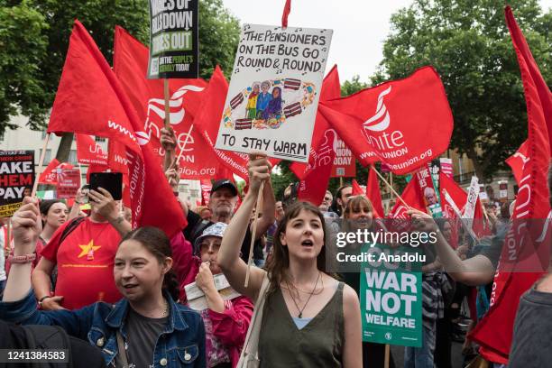 Demonstrators stop outside Downing Street as they march against the govenment's handling of the cost of living crisis and demand a better deal for...