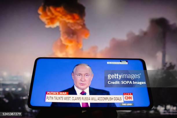 In this photo illustration, a live broadcast of Vladimir Putin, the president of Russia, on the CNN TV network from the United States. Putin provoked...