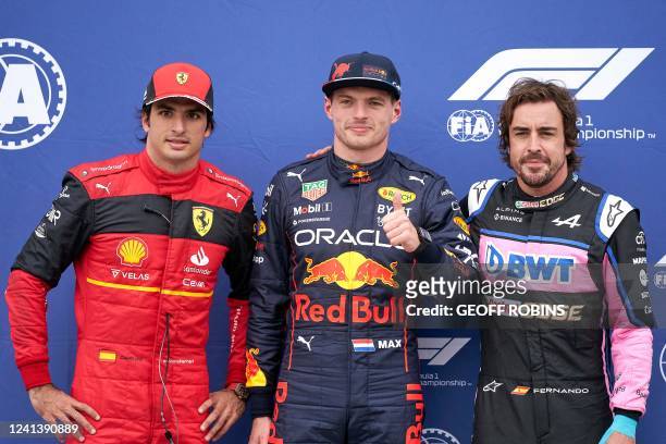 Red Bull Dutch driver Max Verstappen gives the thumbs up as he poses with Ferrari's Monegasque driver Charles Leclerc and Alpines Spanish driver...
