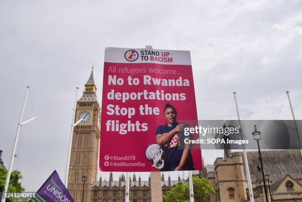 Placard opposing the deportation of refugees to Rwanda is seen during the demonstration in Parliament Square. Thousands of people and various trade...