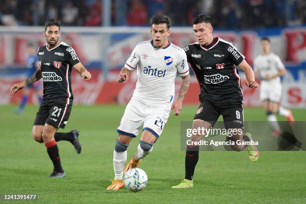 Felipe Carballo of Nacional and Thiago Borbas of River Plate fight for the ball during a match between Nacional and River Plate as part of Torneo...