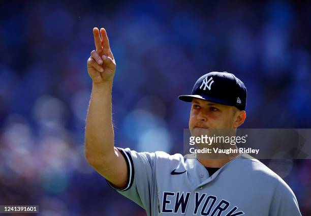 Jameson Taillon of the New York Yankees signals to the crowd after leaving the game in the sixth inning during a MLB game against the Toronto Blue...