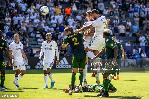 Derrick Williams of Los Angeles Galaxy heads the ball during the match against Portland Timbers at the Dignity Health Sports Park on June 18, 2022 in...