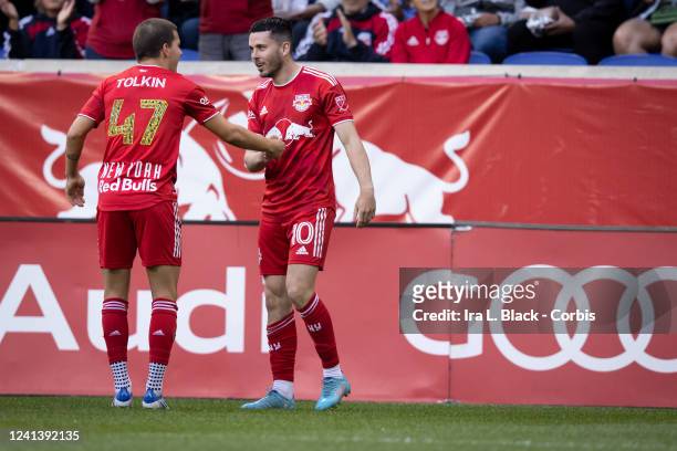 Lewis Morgan of New York Red Bulls celebrates his goal with John Tolkin of New York Red Bulls while wearing the Freedom To Be Juneteenth jersey in...