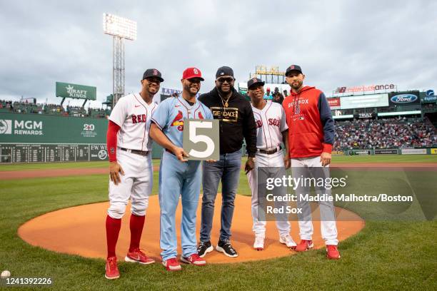 Albert Pujols of the St. Louis Cardinals poses for a photo with Xander Bogaerts of the Boston Red Sox, Former Boston Red Sox designated hitter David...