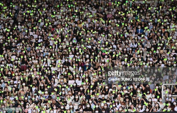 In this picture taken on June 18 fans watch the performance of K-pop groups during the 2022 Dream Concert at Jamsil stadium in Seoul.