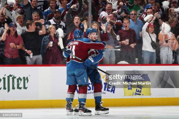 Andrew Cogliano and Cale Makar of the Colorado Avalanche celebrate a goal against the Tampa Bay Lightning in Game Two of the 2022 Stanley Cup Final...