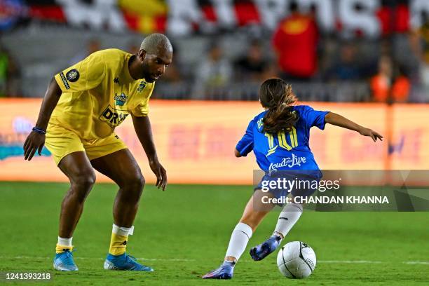 Brazilian social media star and a football player Adriene Dos Santos controls the ball during "The Beautiful Game" a celebrity football match at DRV...