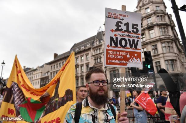 Protester holds a placard expressing his opinion during the rally Thousands of protesters marched through central London during a rally organized by...