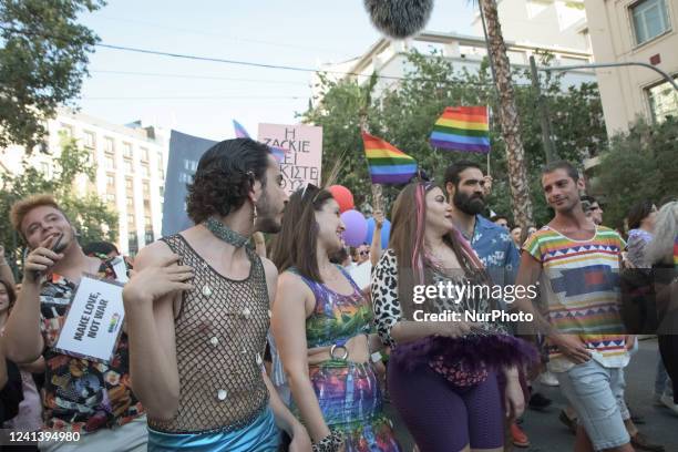 Thousands of people march in the streets of city center during the annual Gay Pride parade organized by LGBT activists in Athens, Greece on June 18,...