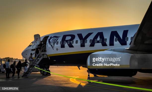 People board in the Ryanair FR4716 at Brindisi Airport, also known as Brindisi Papola Casale Airport and Salento Airport, in Brindisi, Italy, on June...