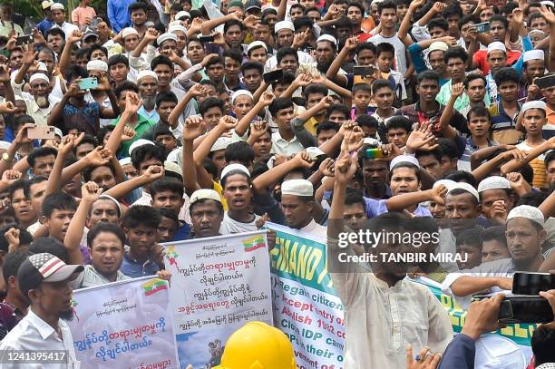 Rohingya refugees walk a "Go home campaign" rally demanding repatriation at Kutupalong Rohingya camp in Cox's Bazar on June 19, 2022. - Tens of...
