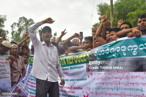 Rohingya refugees walk a "Go home campaign" rally demanding repatriation at Kutupalong Rohingya camp in Cox's Bazar on June 19, 2022. - Tens of...