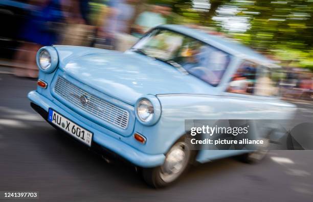 June 2022, Saxony, Zwickau: Around 50 participants in the 20th International Trabant Drivers' Meeting will drive through Zwickau in a live Trabi...