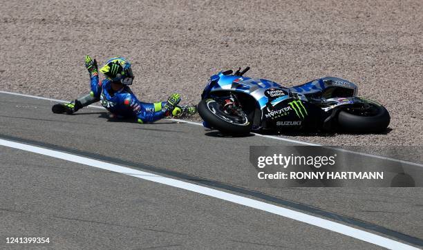 Suzuki Ecstar's Spanish rider Joan Mir crashes during the German MotoGP Grand Prix at the Sachsenring racing circuit in Hohenstein-Ernstthal near...