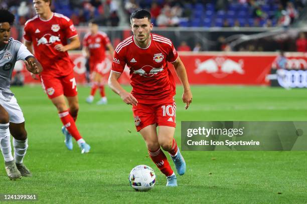 New York Red Bulls midfielder Lewis Morgan controls the ball during the second half of the Major League Soccer game between the New York Red Bulls...