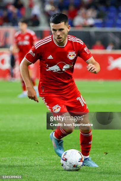 New York Red Bulls midfielder Lewis Morgan controls the ball during the second half of the Major League Soccer game between the New York Red Bulls...