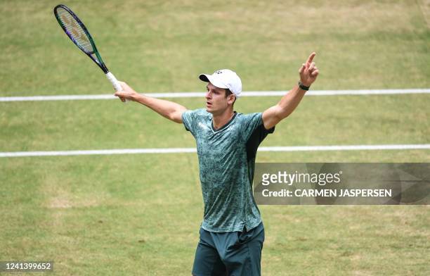 Poland's Hubert Hurkacz celebrates after winning his singles final match against Russia's Daniil Medvedev at the ATP 500 Halle Open tennis tournament...