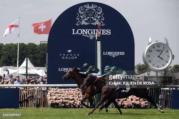 British jockey Hollie Doyle riding Nashwa crosses the finish line ahead of France's Gerald Mosse riding La Parisienne at the end of the Prix de Diane...