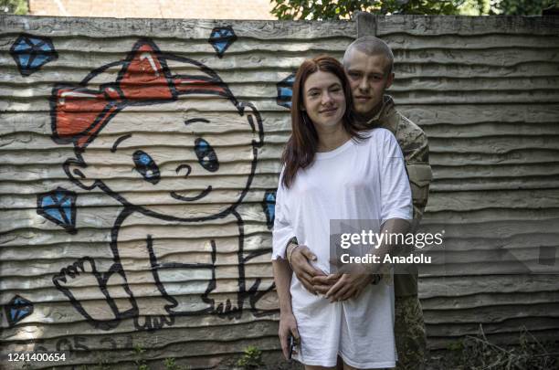 Year old Ukrainian soldier codenamed Anton fighting at the front against Russia for months poses for a photo with his pregnant wife during the...