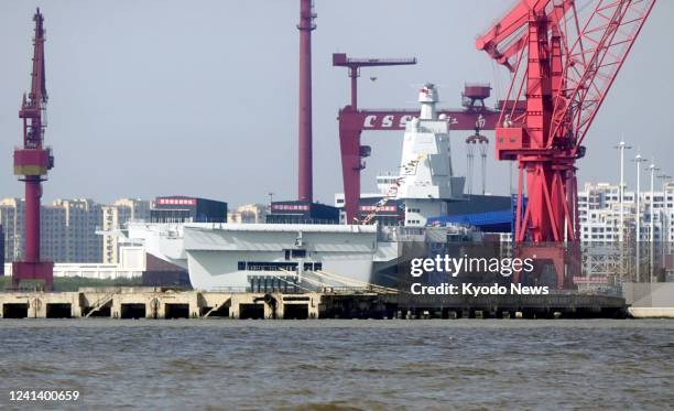 Photo taken on June 18 in Shanghai shows China's third aircraft carrier, Fujian. The first homegrown aircraft carrier with advanced aircraft launch...