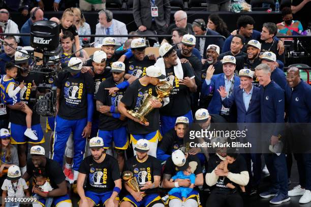 The Golden State Warriors pose for a photo with the Larry O'Brien Championship Trophy after winning Game Six of the 2022 NBA Finals on June 16, 2022...