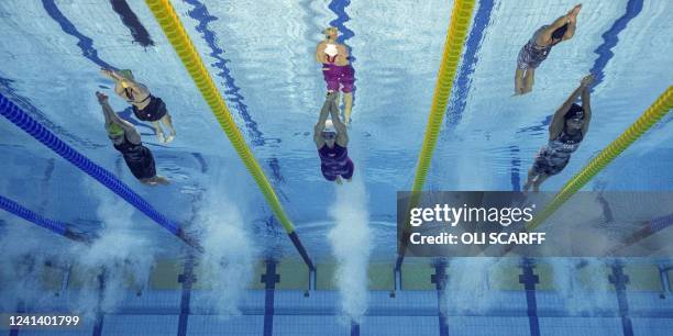 Australia's Brianna Throssell , France's Marie Wattel and USA's Torri Huske compete in the women's 100m butterfly finals during the Budapest 2022...