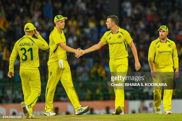 Australia's Josh Hazlewood celebrates with teammates after taking the wicket of Sri Lanka's Dhananjaya de Silvaduring the third one-day international...
