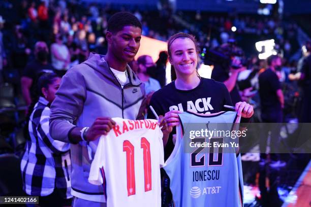 Soccer player, Marcus Rashford of Manchester United swaps jerseys with Sabrina Ionescu of the New York Liberty before the game on June 19, 2022 at...