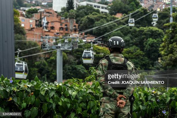 Soldier stands guard at a Metrocable station in Medellin, Colombia, during the presidential runoff election, on June 19, 2022. - Colombians vote for...