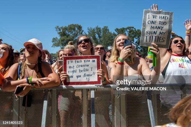 Fans of US Singer Fletcher show their love as she performs at the Bonnaroo Music and Arts Festival on Day 4, June 19, 2022 in Manchester, Tennessee.