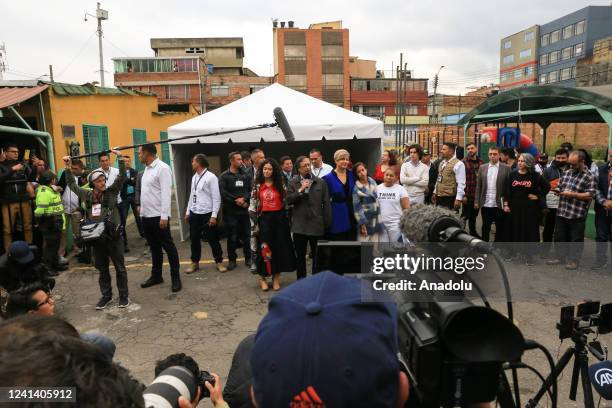 Presidential Candidate, Gustavo Petron speaks to people with his wife Veronica Alcocer Garcia after he casted his vote at the polling station during...