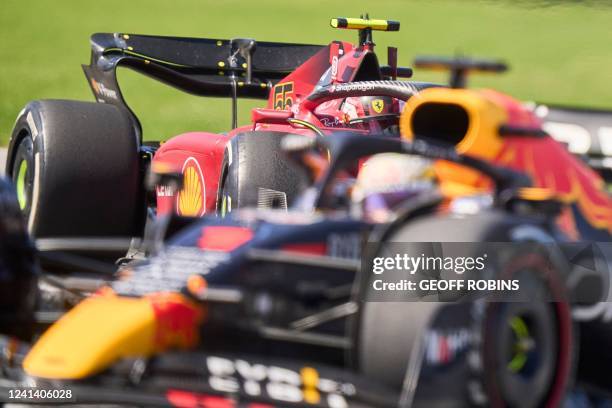 Ferrari's Spanish driver Carlos Sainz Jr follows Red Bull Racing's Dutch driver Max Verstappen around a bend during the Canada Formula 1 Grand Prix...