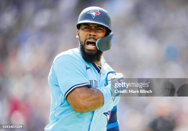 Teoscar Hernandez of the Toronto Blue Jays celebrates his three run home run against the New York Yankees in the seventh inning during their MLB game...