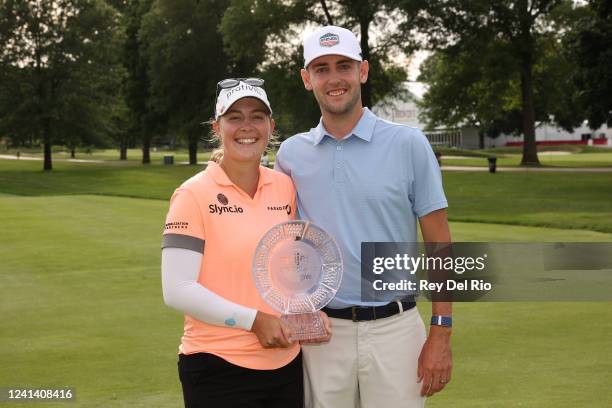 Jennifer Kupcho of The United States and her husband Jay Monahan poses with the trophy after winning the Meijer LPGA Classic at Blythefield Country...