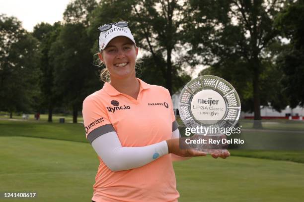 Jennifer Kupcho of The United States poses with the trophy after winning the Meijer LPGA Classic at Blythefield Country Club on June 19, 2022 in...