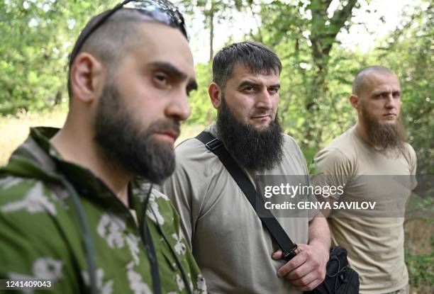 In this photograph taken on June 9 members of the volunteer Sheikh Mansour battalion Mansour , Islam and Asadulla speak to an AFP journalist during...